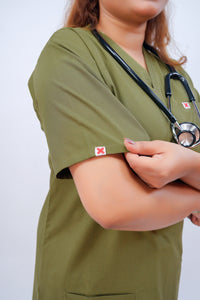 Medixa Muse article wearing a V-neck scrub and regular-fit trouser. the fabric is breathable, strechable, medical scrub, medical scrub in pakistan for wemen